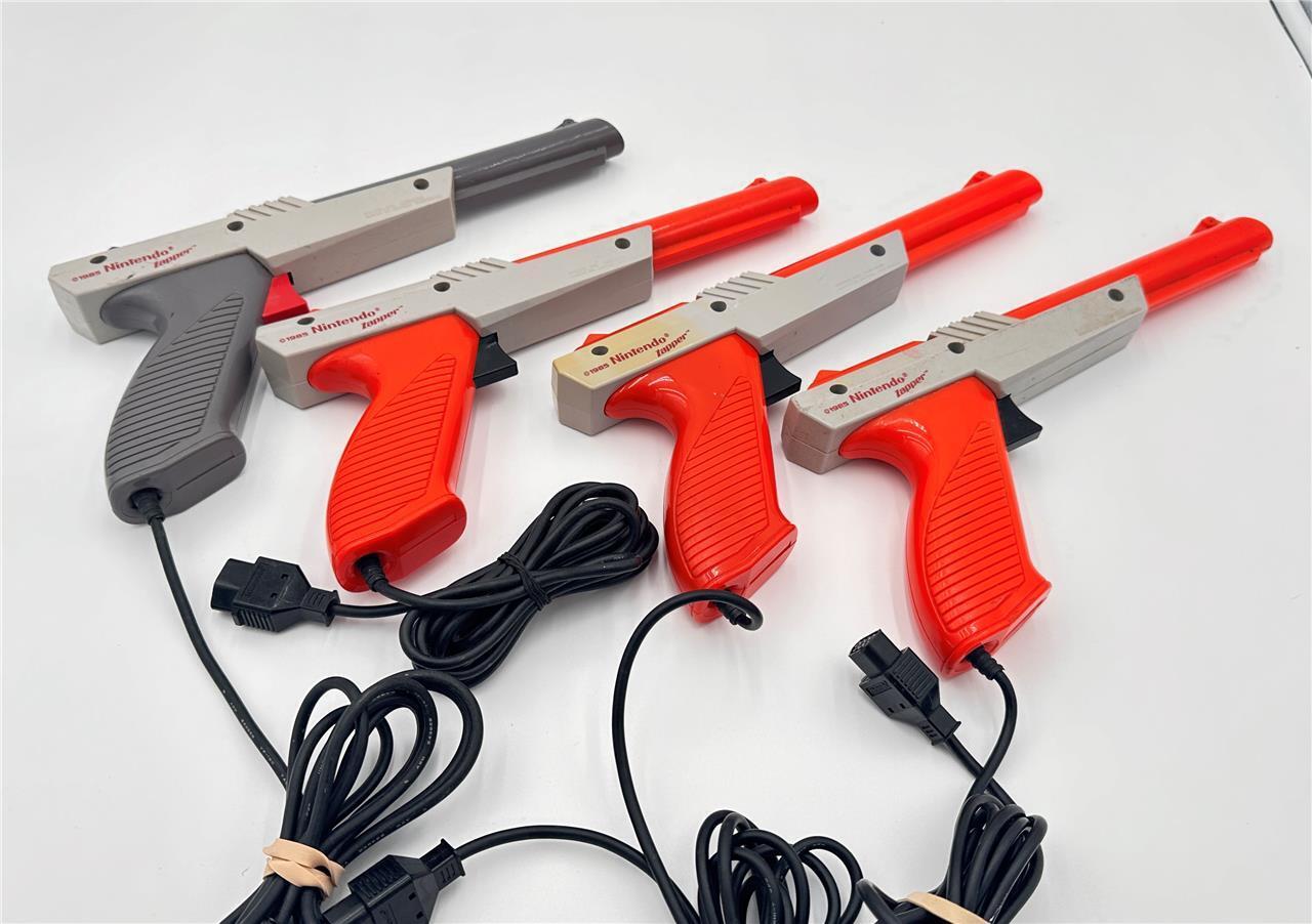 4pc  NES Zappers-  3 orange 1 grey untested